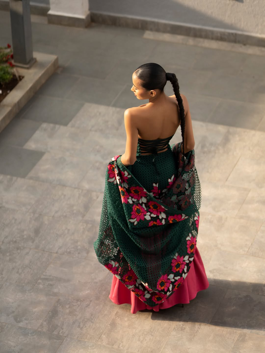 Emerald Reverie — overhead shot, gown sweeping the ground